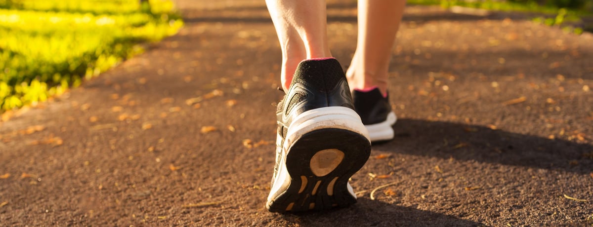 Close-up of a woman's foot and ankle as she is running